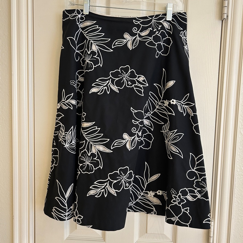 White House Black Market Black Skirt with White Floral Embroidery Design